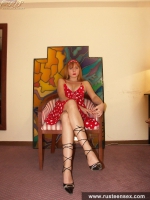 Teen blonde in red dress posing sexy
