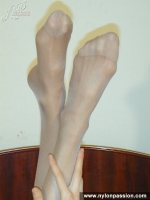 Pantyhose teen brunette shows her pantyhosed feet
