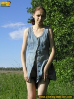 Pissing outdoor on a green grass
