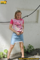 Pissing outdoor near the house