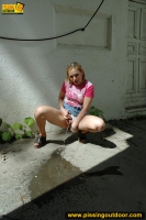 Pissing outdoor near the house