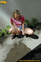 Pissing outdoor near the house