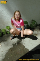 Pissing outdoor near the house
