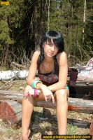 Outdoor pissing in summer forest