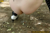 Pissing outdoor on pond beach