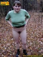 Pissing outdoor on dried leaves on a ground