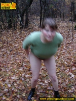 Pissing outdoor on dried leaves on a ground