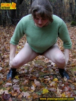 Pissing outdoor on dried leaves on a ground