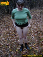 Pissing outdoor on dried leaves on a ground