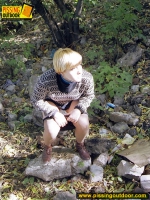 Pissing teen walks and pisses outdoor