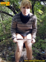 Pissing teen walks and pisses outdoor