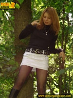 Pissing outdoor on a fallern trunk
