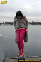 Outdoor pissing on embankment by MILF brunette