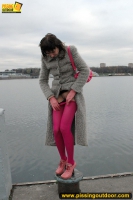 Outdoor pissing on embankment by MILF brunette