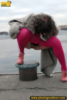 Outdoor pissing on embankment by MILF brunette