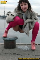 Outdoor pissing on embankment by MILF brunette