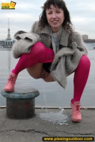 Outdoor pissing on embankment by MILF brunette