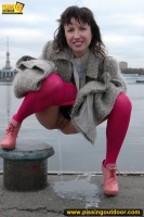 Outdoor pissing on embankment by MILF brunette