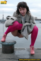 Outdoor pissing on embankment by MILF brunette