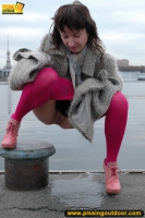 Outdoor pissing on embankment by MILF brunette