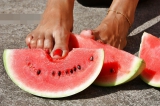 Mature feet and watermelon