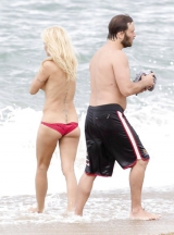Pamela Anderson Goes Topless on a Beach in France