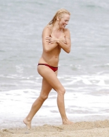 Pamela Anderson Goes Topless on a Beach in France