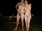 American couple posing to ranch
