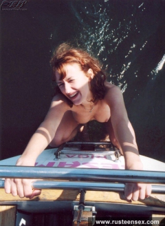 Naked teen redhead posing on yacht - N