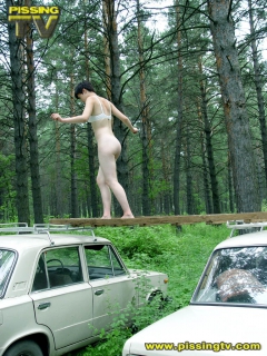 Brunette pissing in a forest - N
