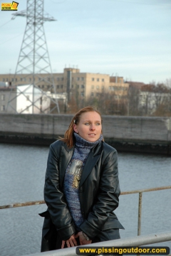 Pissing on the bridge over river - N