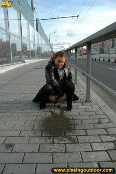 Outdoor pissing of teen blonde in the city street - N