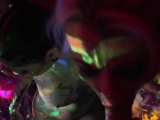 Black-light babes Nadia and Ophelia suck off a colorful cock