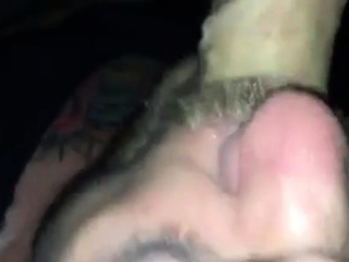 Sucking cum out of a tourist daddy in darkroom