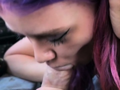 Purple haired teen milks a big cock into her mouth